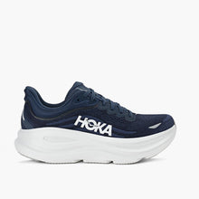 Navy running shoe with white sole on a white background